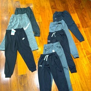 8 pairs of boys pants - one nwt, Nike & Underarmor - size medium